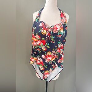 Floral one piece w small cutout on top. Fits a Sz 1x, tags removed. Halter style
